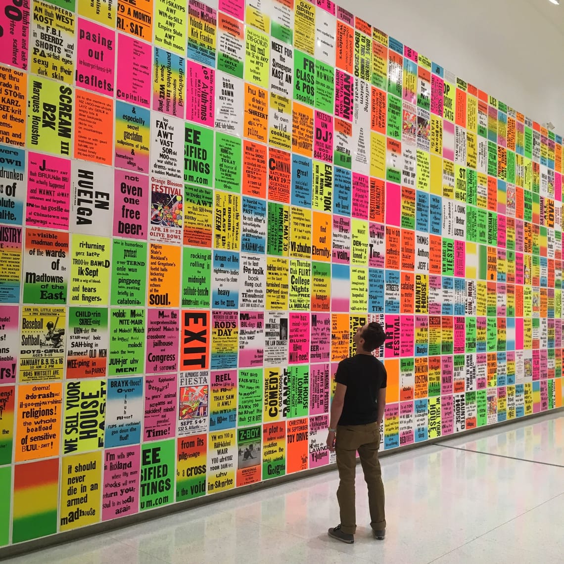 Joe standing in front of colorful art.